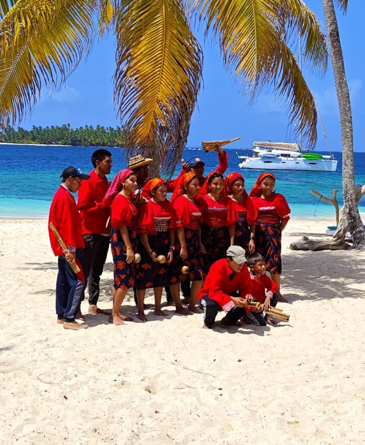 Group of Guna men and women in traditional clothing during a cultural gathering in Guna Yala, Panama