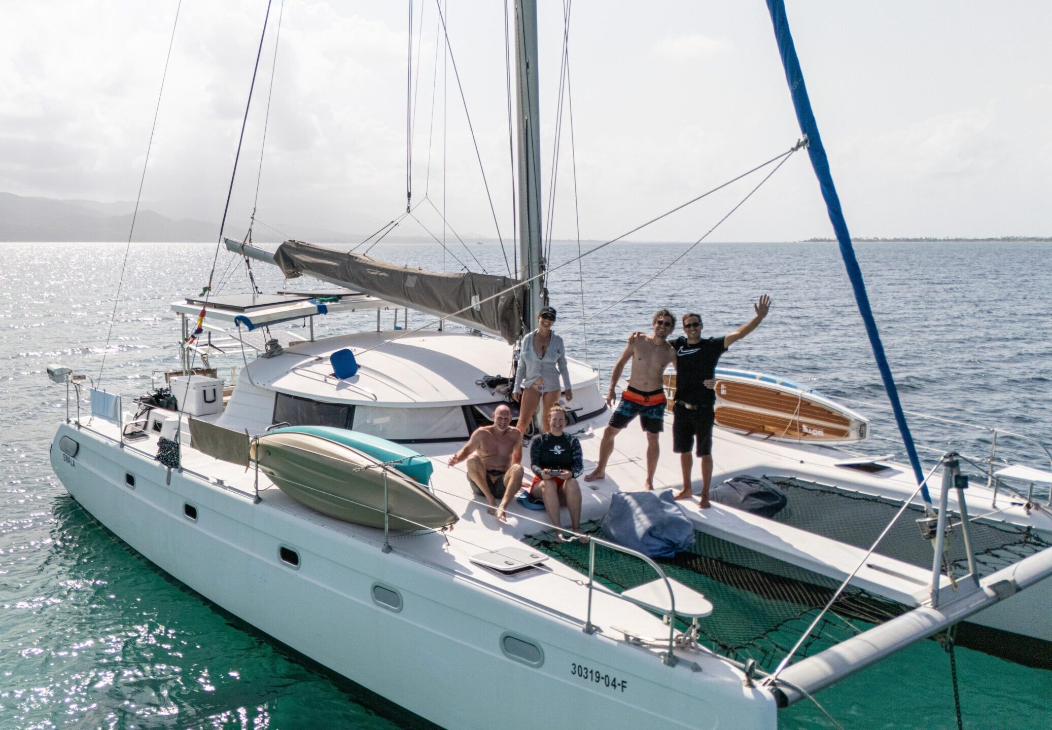 Venezia 42 catamaran with guests sunbathing and preparing for sailing in San Blas, Panama